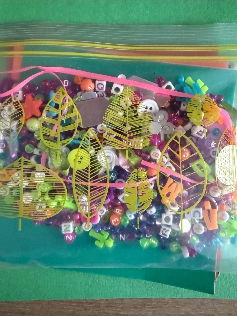 Variety craft supplies, origami, raffia, beads, open package